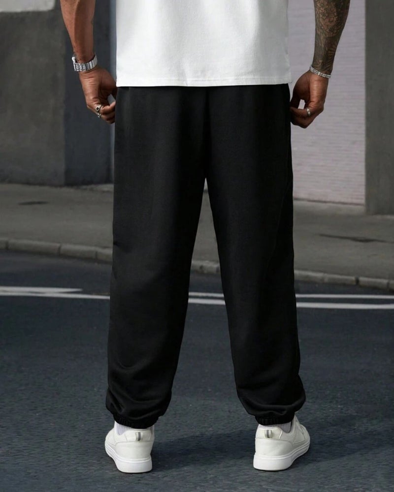 فلاينوف بنطلون جوغر رجالي أسود مطبوع بقصة فضفاضة - Image 3